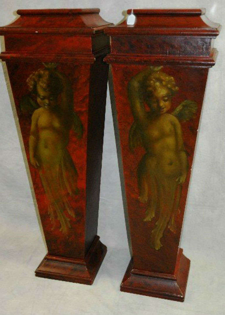 Pair of Italian faux painted marble pedestals with Cherub figures.

After 43 years of business we are retiring. Everything must be sold. Many of the pieces listed here on 1stdibs represent markdowns below our cost. We thank everyone for their