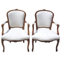 Pair of 19th Century Louis XV Carved Walnut Fauteuils.