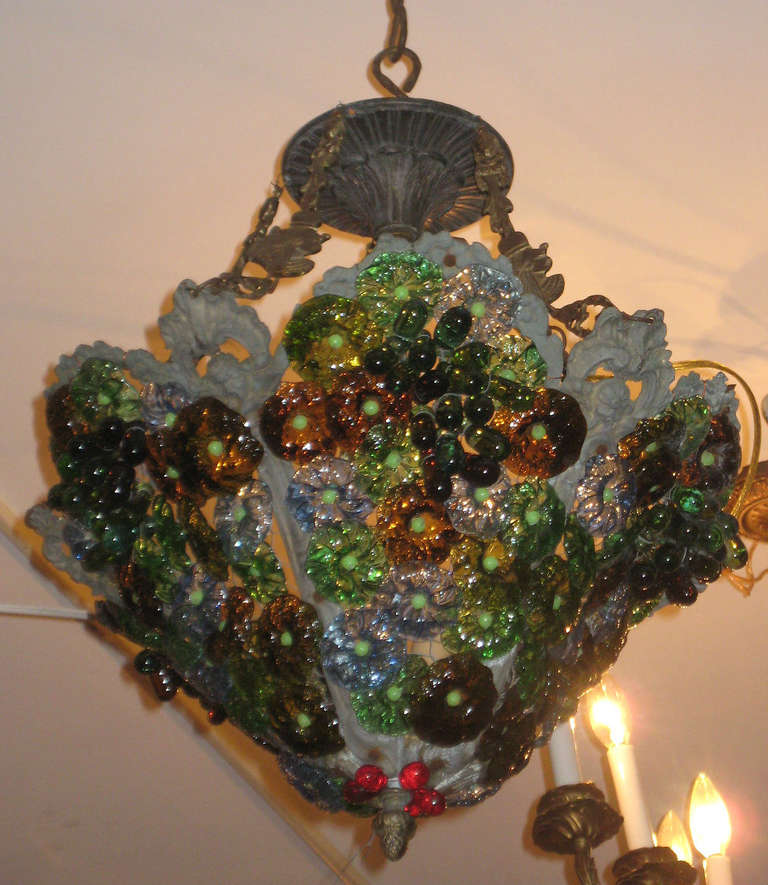 Mid-century Murano colored glass chandelier; basket form with grapes, cherries and rosettes ending with an acorn finial.