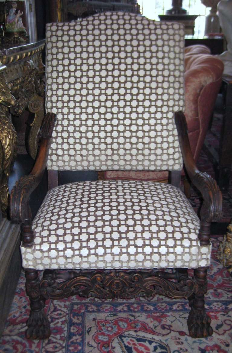 Two similar 19th c. Italian carved oak Open Arm Chairs, each having shaped rectangular backs above upholstered seats, one with Spanish foot the other Paw foot.

After 43 years of business we are retiring. Everything must be sold. Many of the
