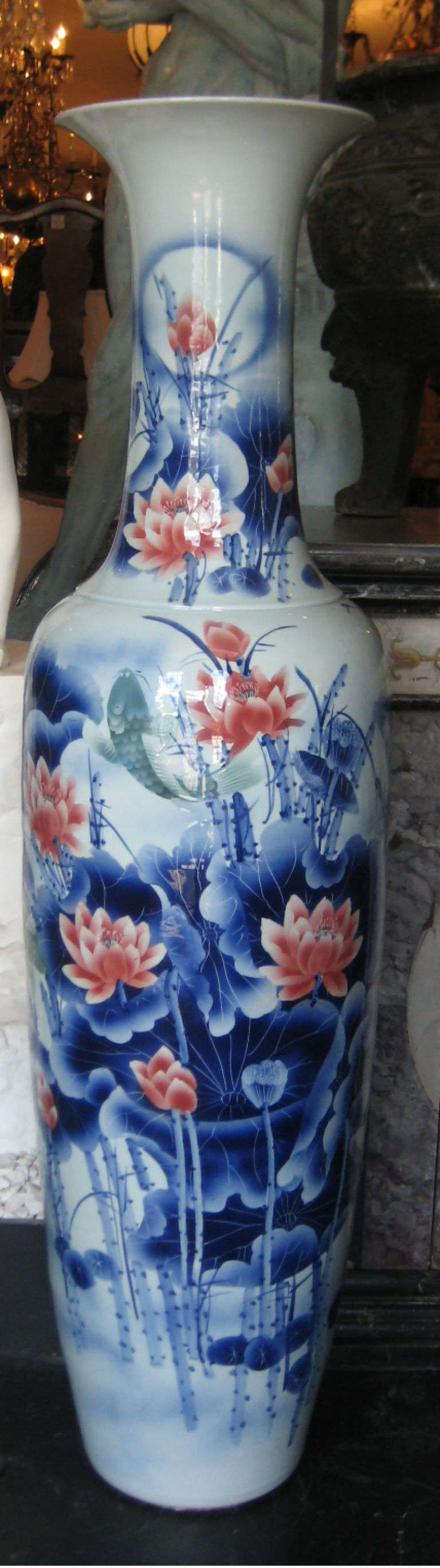 Large Chinese export porcelain palace vase, the front beautifully decorated with Lotus flowers, the reverse with Koi fish and calligraphy.

According to Feng Shui, a fish represents wealth and prosperity because the actual word in Chinese for fish