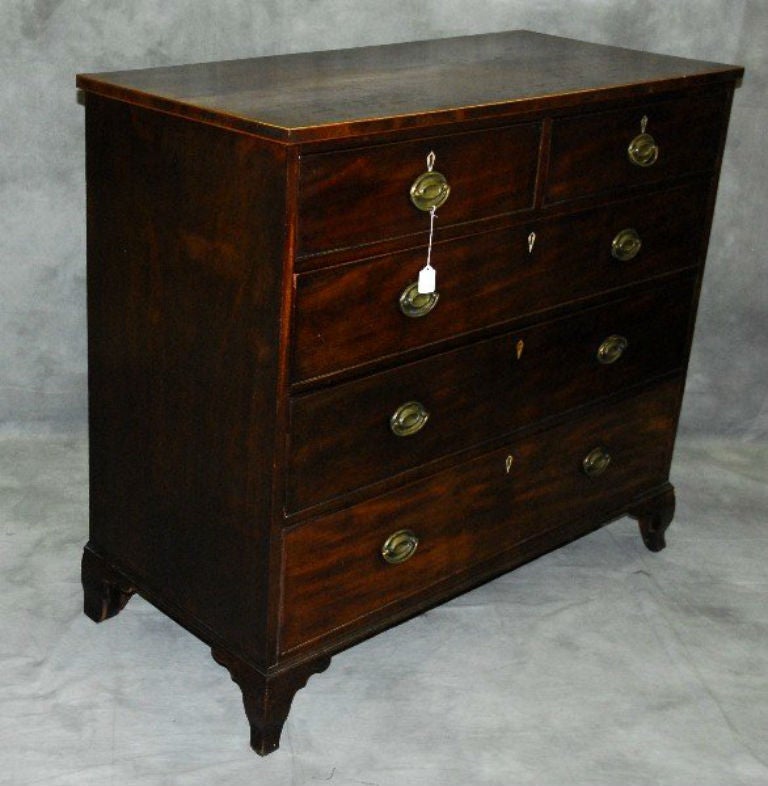 18th c mahogany five-drawer chest with two short drawers over three long drawers, ivory escutcheons and original brass bale handles.