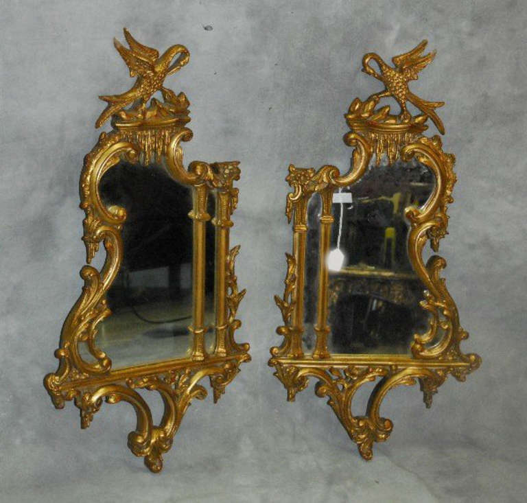 Pair of Georgian style gilt-wood mirrors with Phoenix birds.