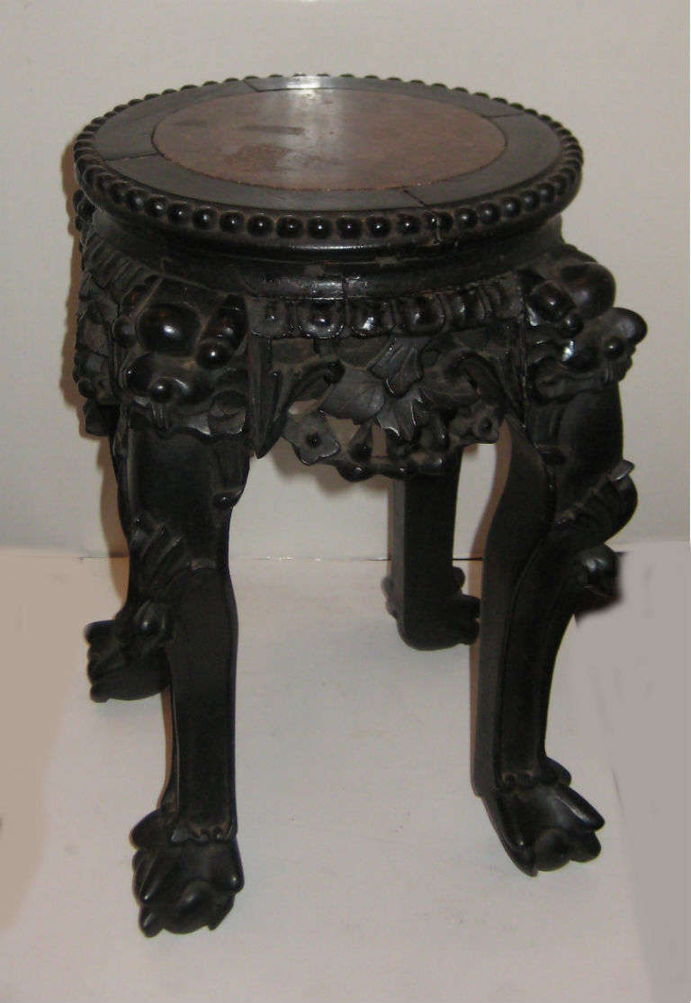 Diminutive Chinese carved hardwood top table with inset marble top.