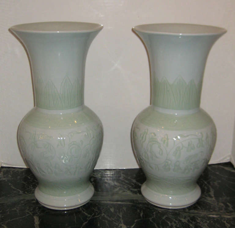 Pair of Chinese celadon Gu-form vase with incised designe, the underside with four character mark.