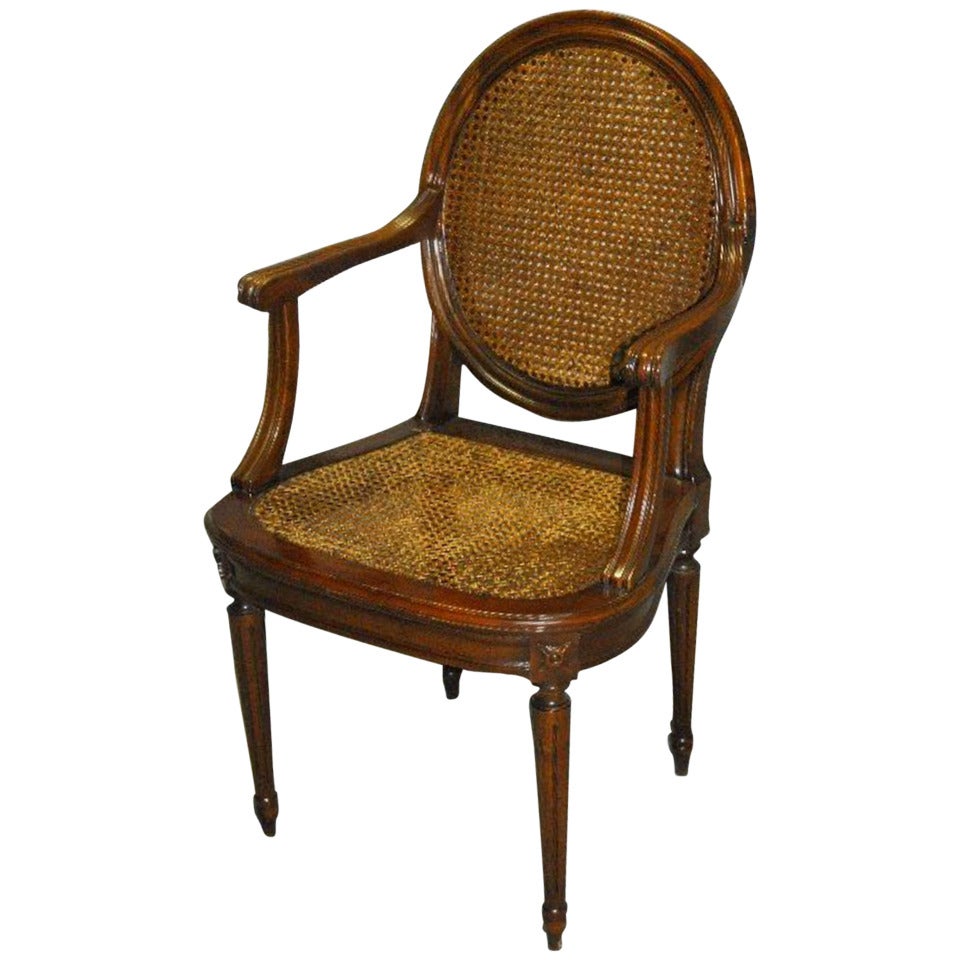 Louis XVI Carved Mahogany and Cane Desk Chair For Sale