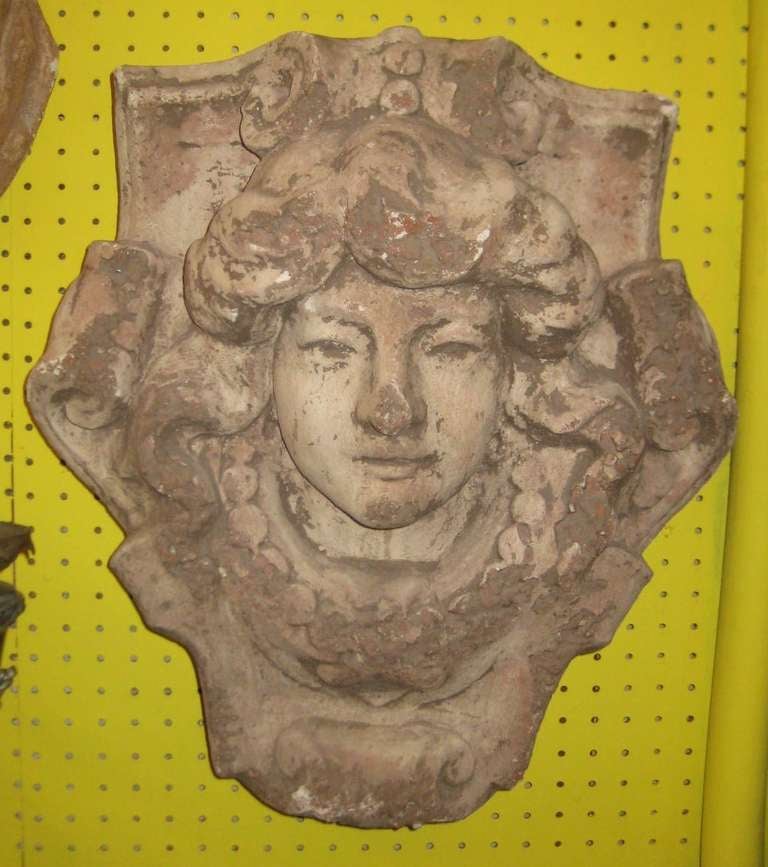 Pair of Italian cast stone heads of Medusa.