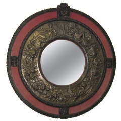 19th c. Renaissance revival carved oak frame and repoussé brass mirror.