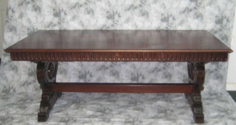 19th c. Italian Renaissance style carved mahogany refectory table with single frieze drawer, having a rectangular top with molded edge on baluster shaped legs with stretcher support on plinth base and scroll feet.