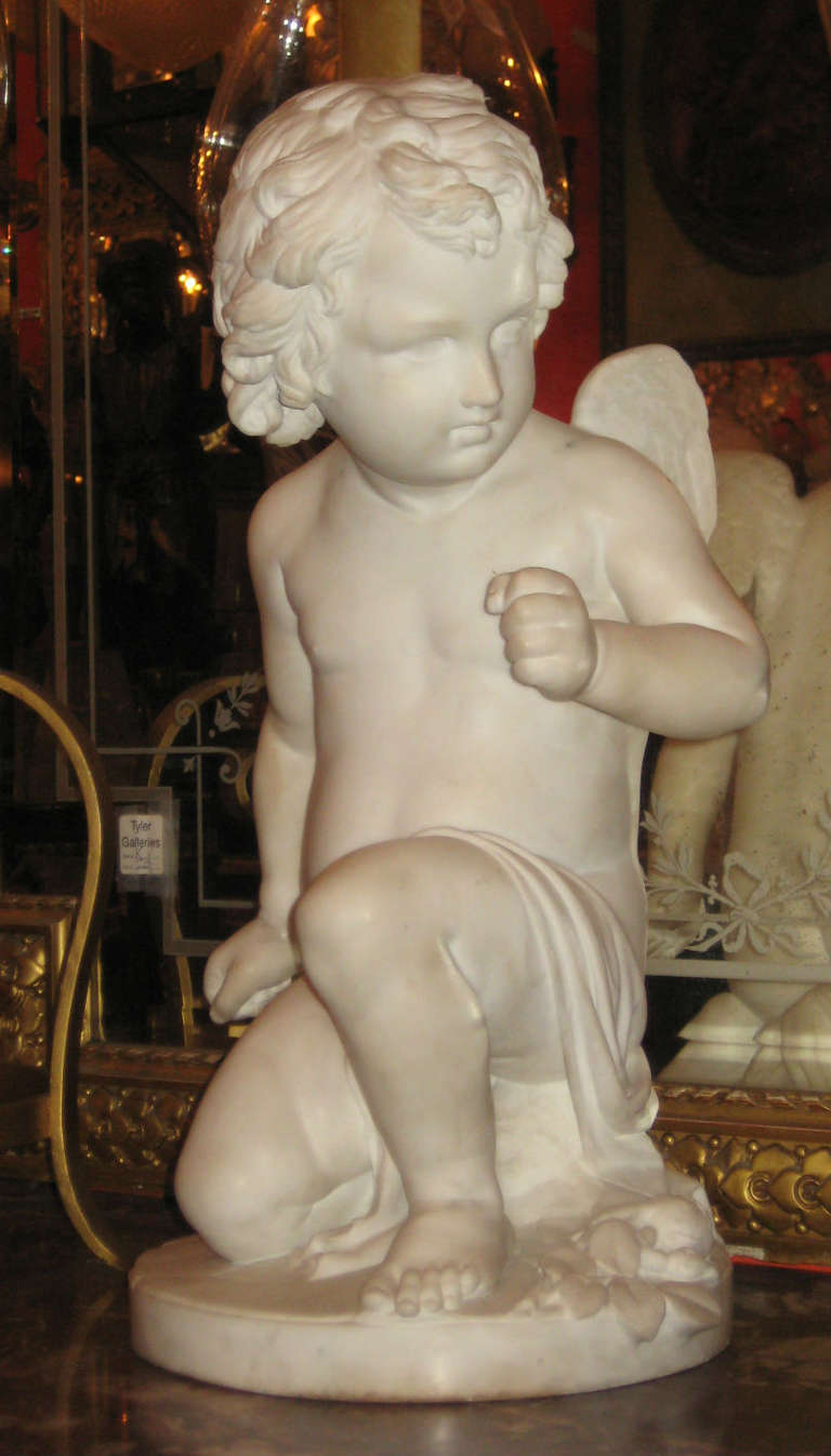 Pio Fedi, Italian 1815-1892, A Winged Putto Kneeling on One Leg, marble, inscribed in base: Pio Fedi Sculptor Firenze