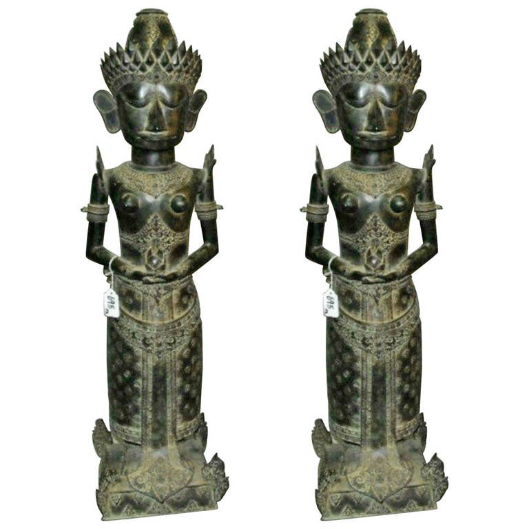 Large pair of Indonesian bronze standing King and Queen figures.