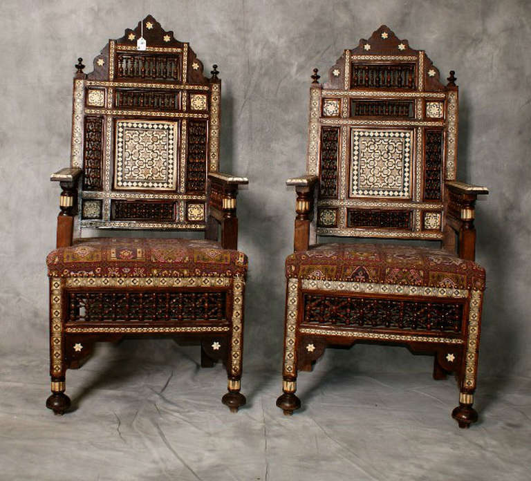 Large pair of bone and mother of pearl inlaid Moroccan arm chairs.