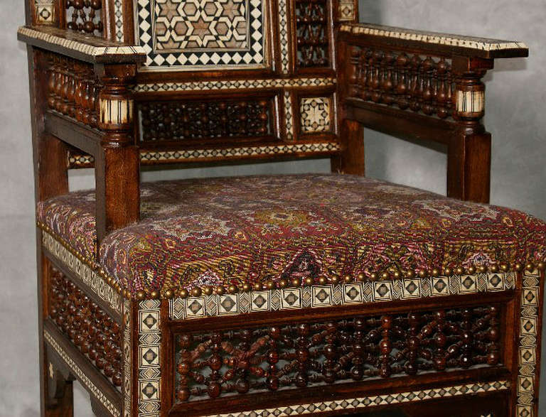 Wood Large pair of inlaid Moroccan arm chairs.