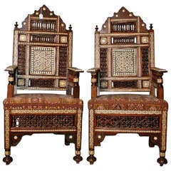 Large pair of inlaid Moroccan arm chairs.