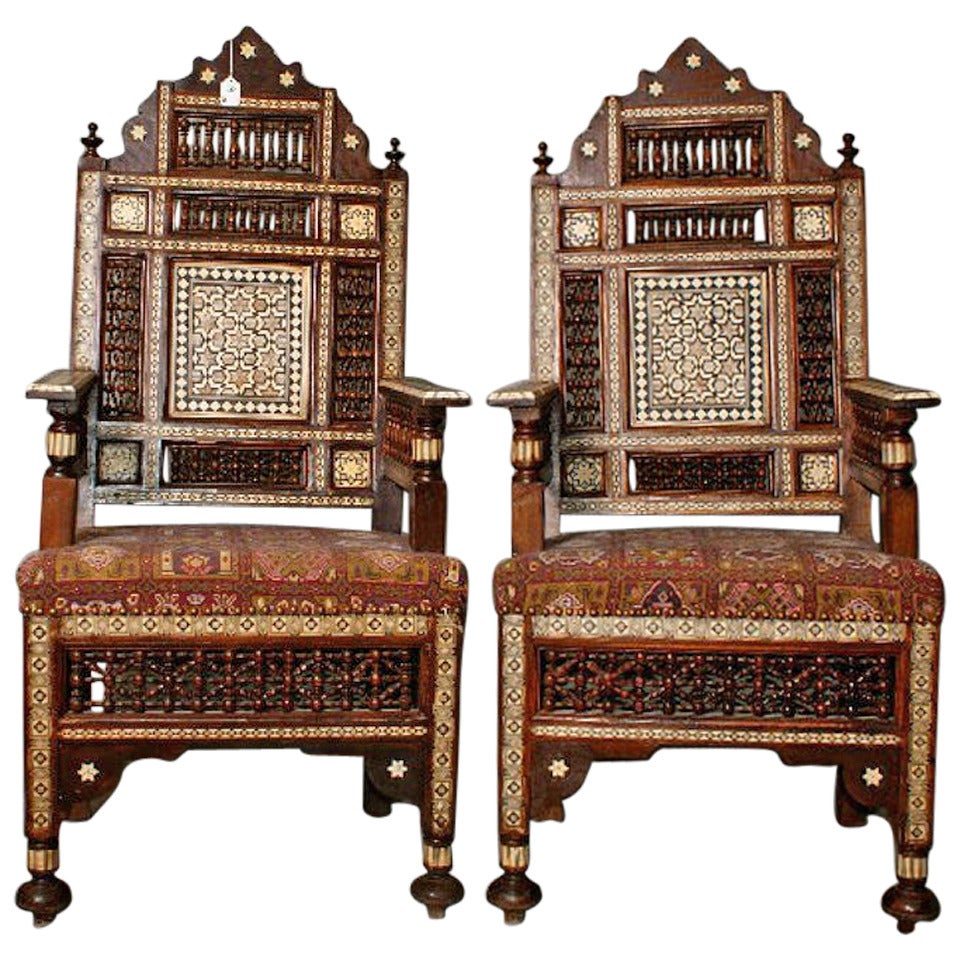 Large pair of inlaid Moroccan arm chairs.