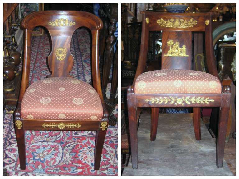 Two Magnificent period French Empire bronze-mounted mahogany chairs, each with drop seat.