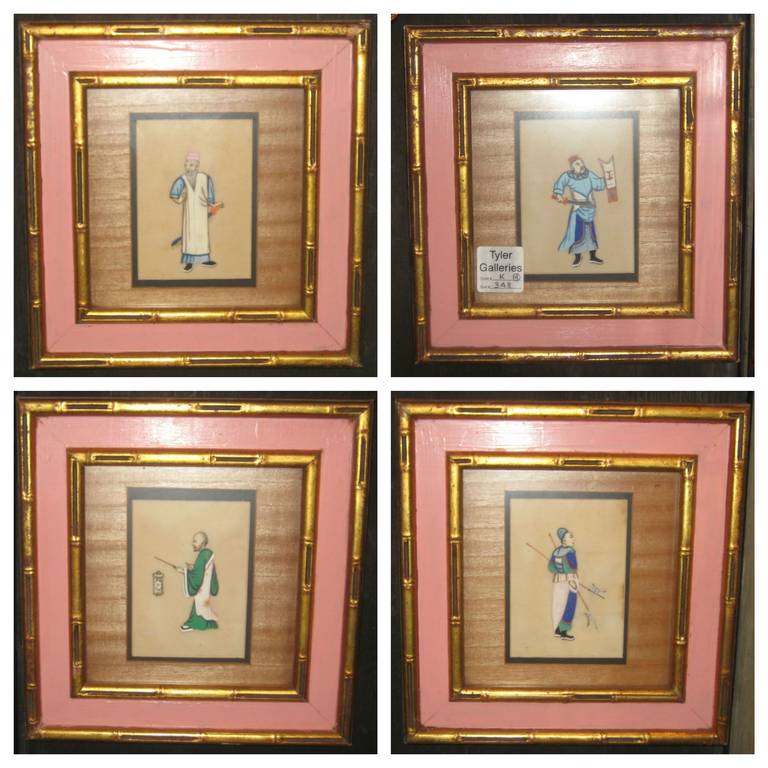 Four antique Chinese silk embroidered and framed pictures depicting a male figure with long sword, one with short sword and shield, one with lantern and one with two pole axes. Silk image: 5