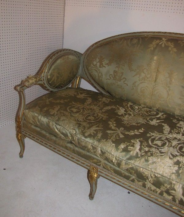 Italian palace size green painted and parcel gilt sofa with original green silk damask upholstery. 

H: 43