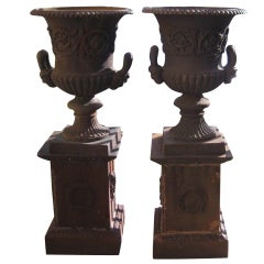 Pair of Antique French Cast Iron Urns and Pedestals with Mask Handles