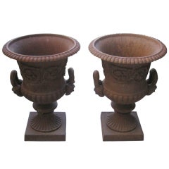 Pair of French Cast Iron Garden Urns  with mask handles.
