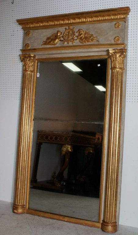 French Empire carved and parcel-gilt mirror with split mirror plate.

After 43 years of business we are retiring. Everything must be sold. Many of the pieces listed here on 1stdibs represent markdowns below our cost. We thank everyone for their