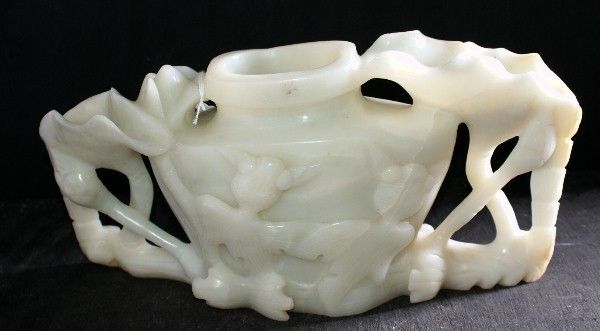 Chinese white jade vase flanked by two lotus leafs and stalks
