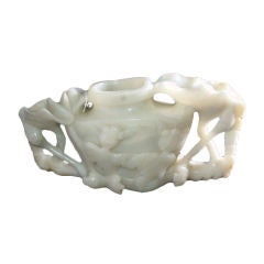 Chinese white jade vase flanked by two lotus leafs and stalks