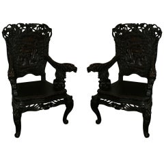 Pair of Carved 19th Cwood Chinese arm chairs