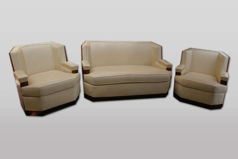 French Art Deco macassar and leather three piece seating group, consisting of a love seat and two arm chairs, circa 1930.
chairs:  w 32