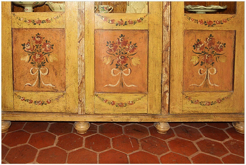 Rare and unique 19th century Italian hand-painted three-door vitrine with flowers, garlands and painted marque designed panels. The doors retain the original handblown glass inserts. Provenance: Purchased from a private collection in Provence, circa