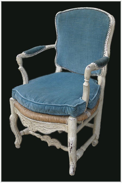 18TH CENTURY FRENCH PROVENÇALE LOUIS XV PAINTED FAUTEUIL WITH A RUSH SEAT, UPHOLSTERED BACK AND CUSHION . CIRCA 1748.<br />
H-36