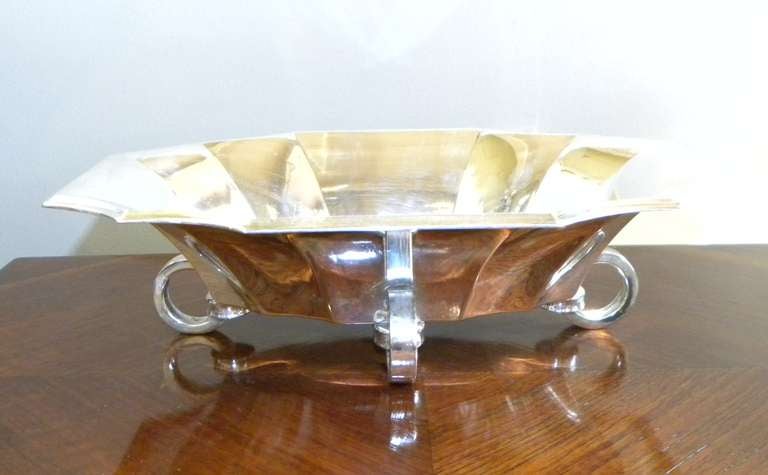 Great looking serving tray, very stylized and in almost perfect condition (I don’t like to say anything is perfect)! This is a substantial silver-plated bronze or brass metal with beautifully flared or fluted edges, additionally modernist round