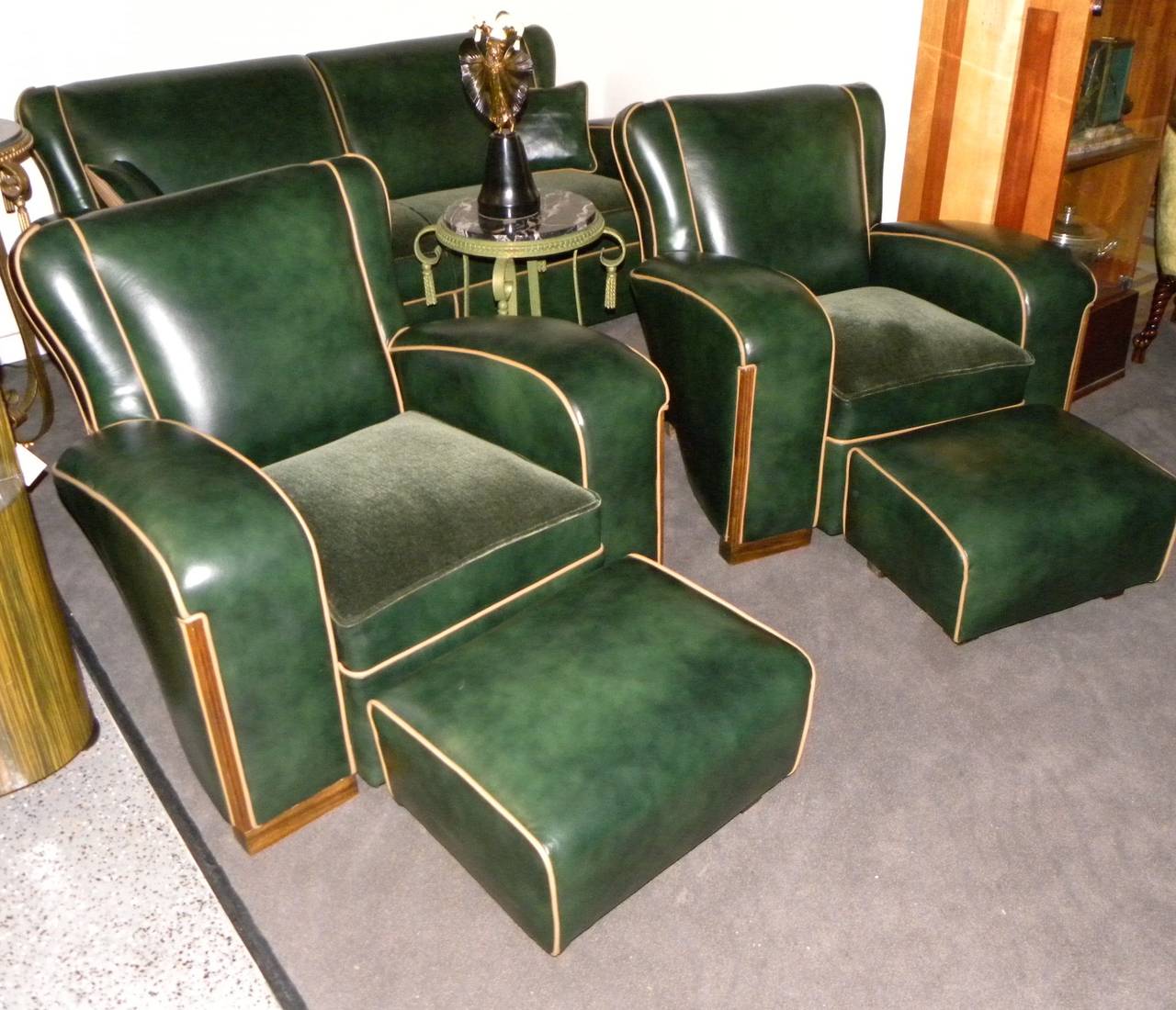 A completely restored and unique sofa suite. This set is newly finished using some of the finest hand finished antiqued leather and mohair fabrics offered. Unique shapes contoured with subtle curves complementing details which makes this offering