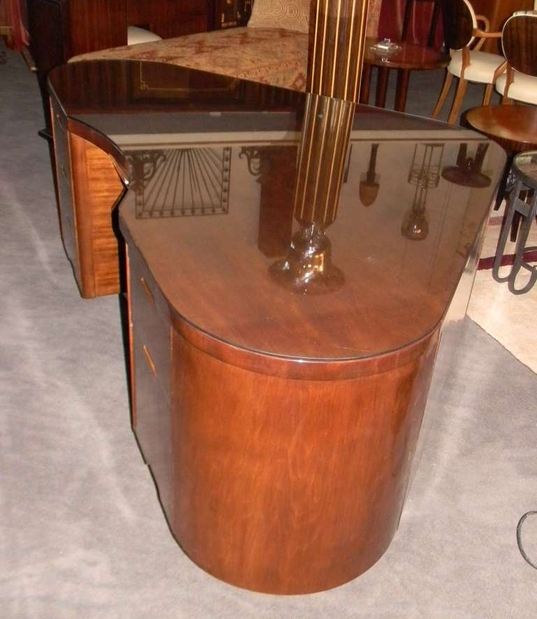 What a unique and super original desk, kind of an Art Deco Icon.  One really needs to see it in person to appreicate the subtle design and over all style of this great American made desk. The front inside drawer has a beautiful engraved copper