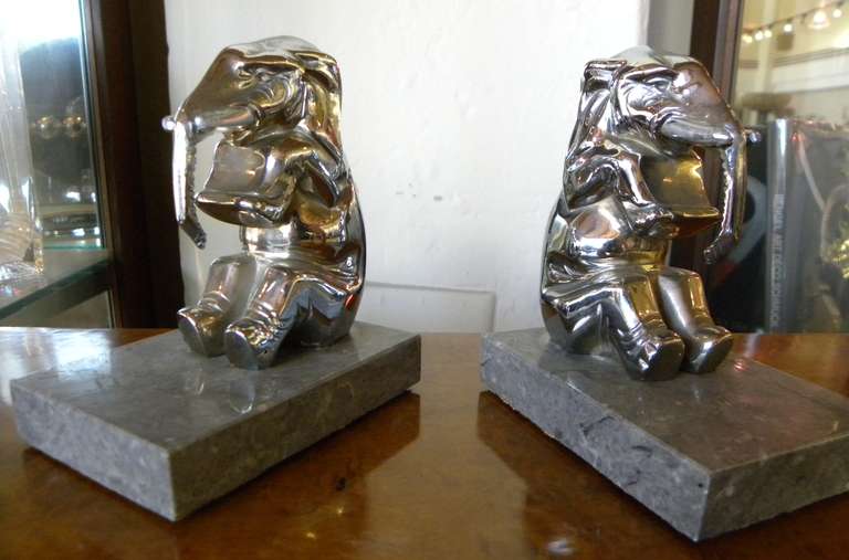 Fun pair of Happy Elephants bookends. Rather cubist shape on a nice marble base. These little ones are sitting up straight ready to serve the most astute reading needs!

Measurements:
4.5″ T x 4″ D x 3″ W.