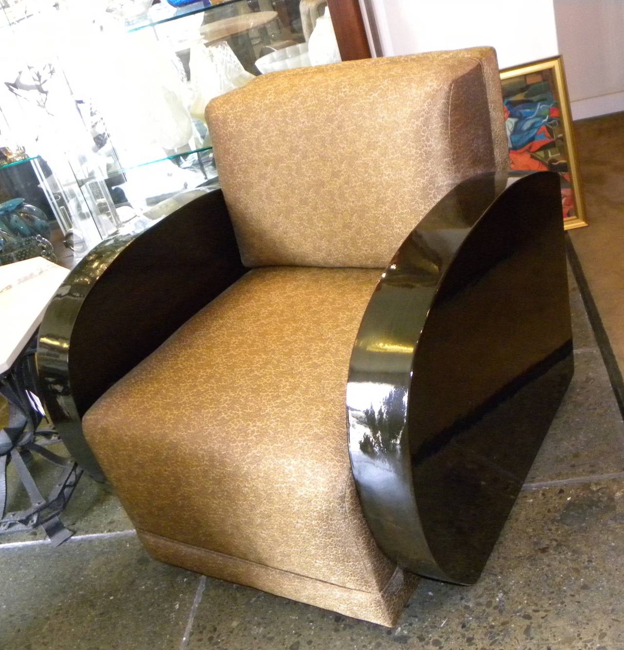 Art Deco Streamline curvilinear design and glamorous French polish wood finish are features of these substantial modernist club style Armchairs.  These custom made chairs (just for us) feature a relaxed point of view, using an unusual fabric that is