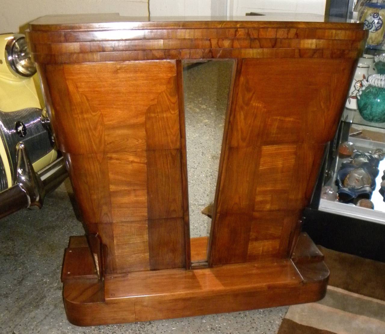 Stand behind bar, lectern, reception desk, Art Deco styling.
 
This original late 1930s bar is a newly restored gem. The rich use of woods with interesting grain arranged in patterns, the stacked wood top and a touch of mirrored trim are two