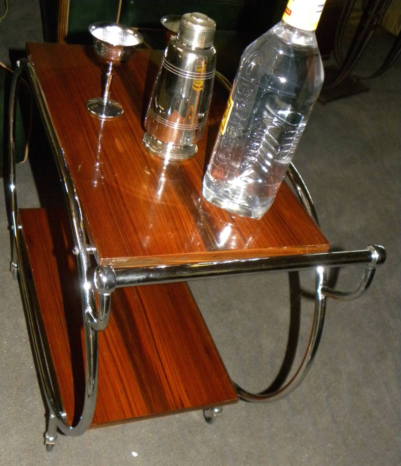 A perfectly restored bar cart. Great Art Deco design with newly re-chromed frame. Great storage for bottles, shakers, champagne buckets and just about anything you need for that sophisticated after or before dinner libation. A must for cocktail