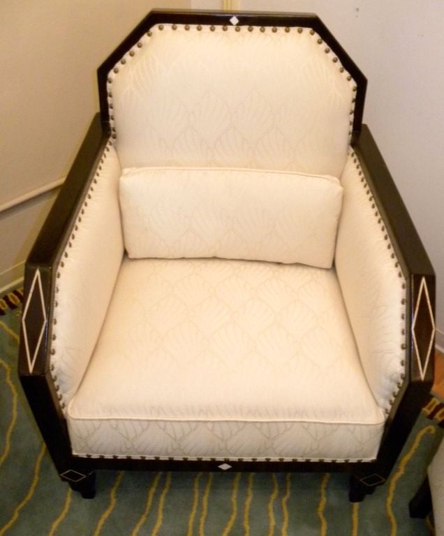A wonderful pair of art deco chairs, suited for many places in your home.  This classic shape with dark wood frame and<br />
accented inlays stands out beautifully against the wonderful cream patterned tone on tone stylized leaf pattern fabric.