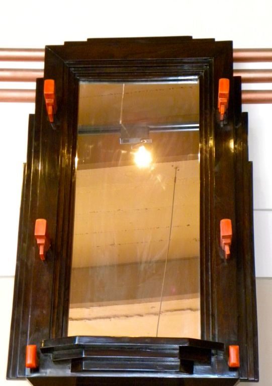 This is a real unique mirror, it is a piece we made in our custom shop in Argentina. I found the design originally in a dress shop, a kind of display mirror with hats hanging on. I just loved the design so much we decided to make if for our own