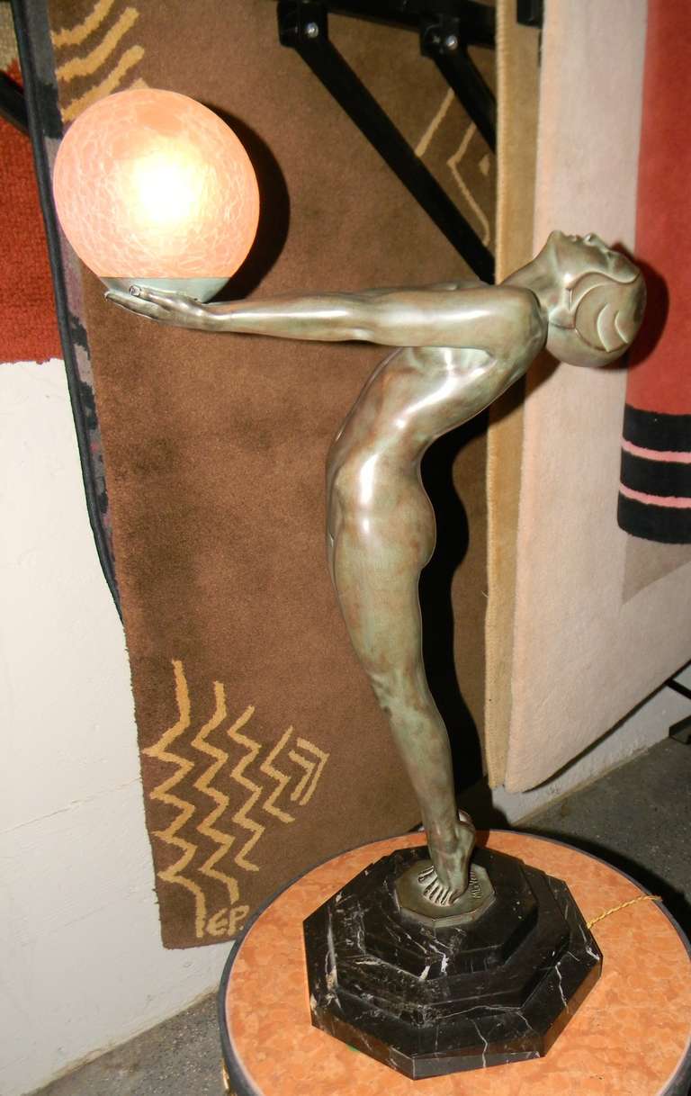 We are pleased to present for your consideration, this beautiful, signed and original, rare statue designed in 1928 by the famous French artist, Max Le Verrier. He is one of the a greatest sculptors of the Art Deco era. The sculpture offered here is