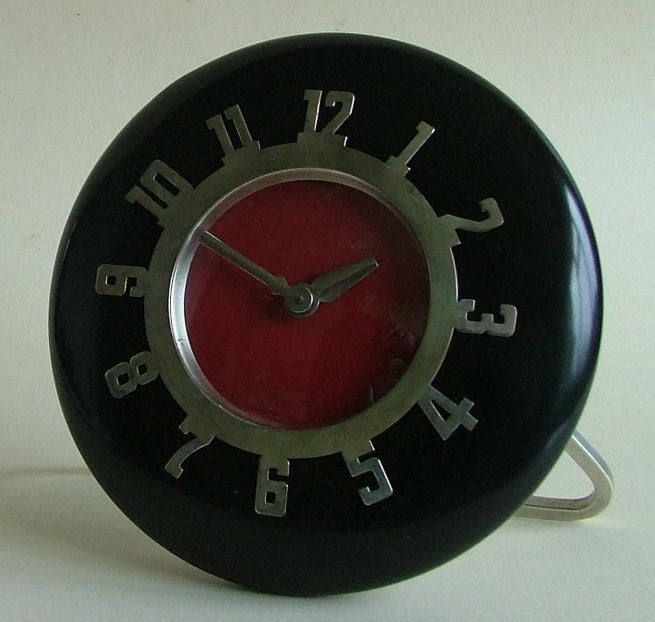 Great looking American 8 day clock.  This is a super looking piece, not large in size but big in looks.<br />
Very simple elegant modern design. This is a hand winding clock in black lacquer with red 