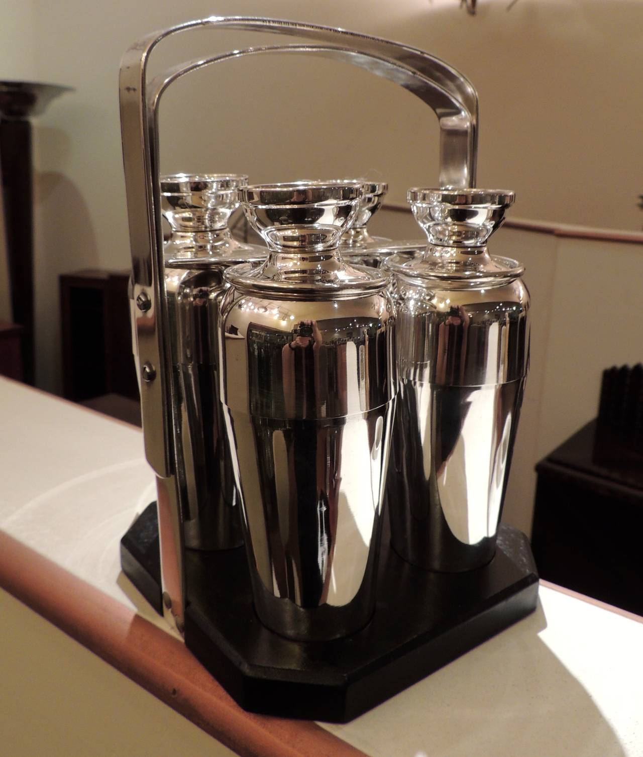 Rare Napier cocktail caddy. Beautifully restored, each piece gleams with new silver. 4 separate cocktail shakers each one give you a choice as host to deliver the perfect drink to your guests, all being impressed by such elegant accoutrement.