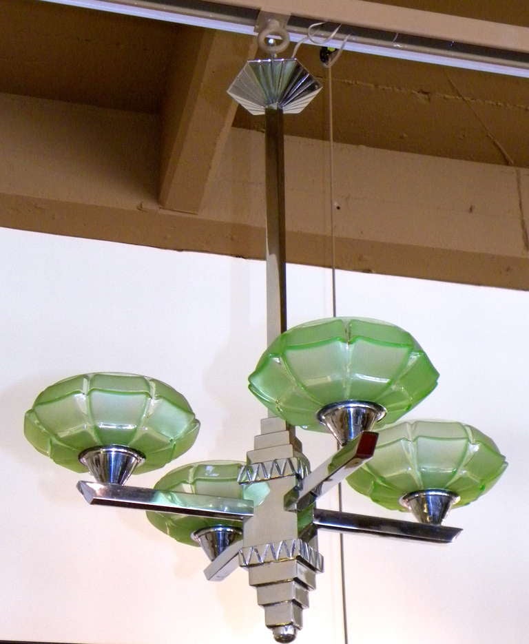 Here is a wonderful restored chandelier that would make any decophile proud to own.  Newly restored with shiny chrome, this wonderful modernist stepped design has all the Art Deco needed for even the most advanced collector.  Would be great over a