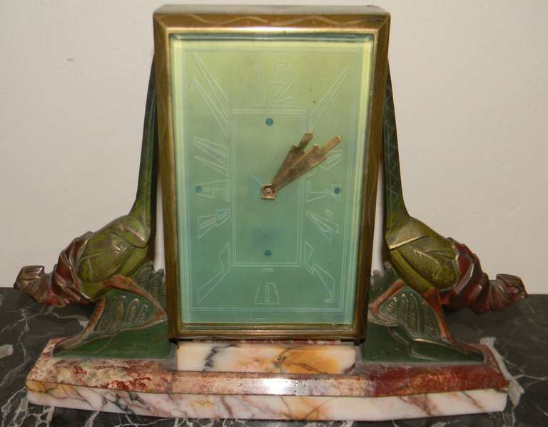 Here is a handsome clock that is extremely rare. Its go so much going on. Great marble, bronze birds, signed on the base of the bronze bird and also a manufacture's signature on the back of the marble. But, look at the colors of the birds with the