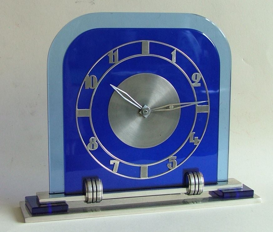 It's a really lovely clock with the two pieces of cobalt glass for the dial and the blue glass detail on the base , all the glass is original and in perfect condition with no chips or scratches . Original plating is all in good order, the chapter