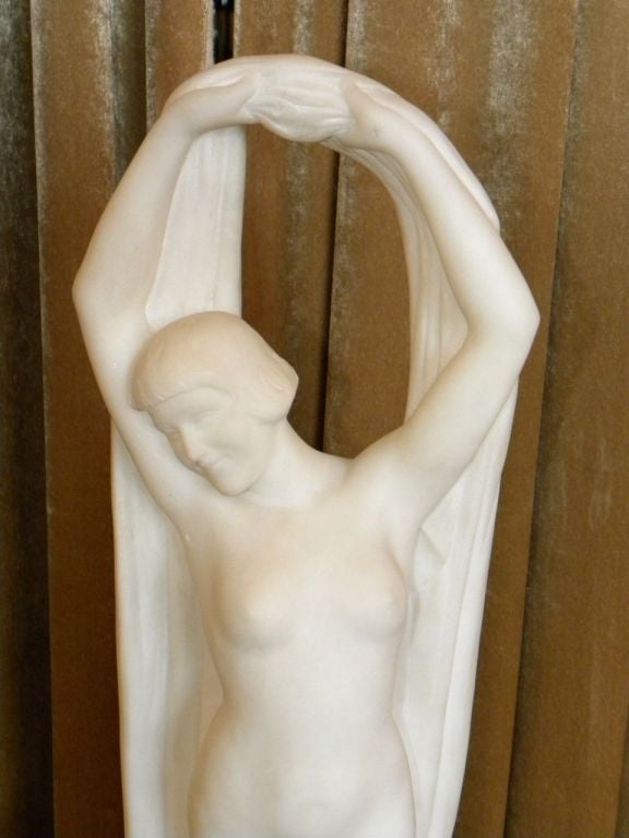 Here is chance to own a real treasure. One of kind and brilliantly carved white marble. This piece depicts a beautiful Venus inspired woman in a Greek Art Deco pose, naked and free (well not really free). She is yours to fall in love with. Very