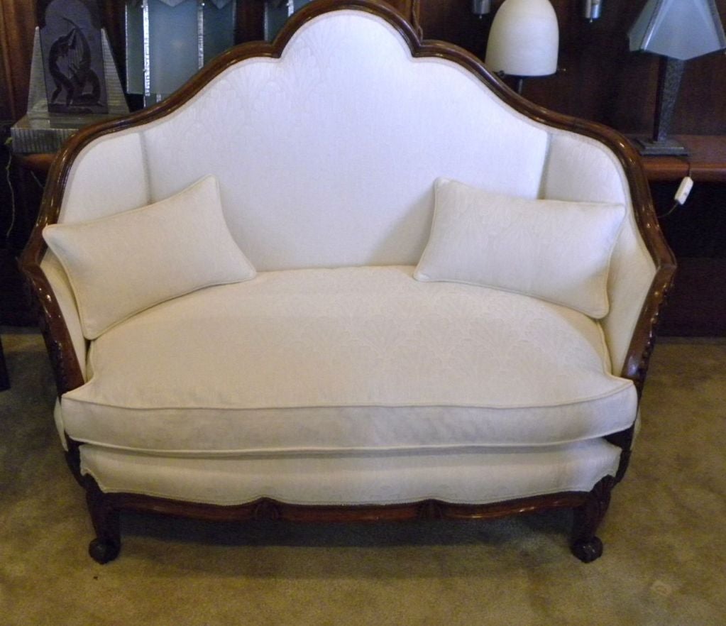 A wonderful settee, recently restored. If you have that perfect little window, or corner, this is a lovely sofa.  Look at all the nice carved details in the arms (but  not too much) and the wonderful stepped upward shape of the back.  Even the 