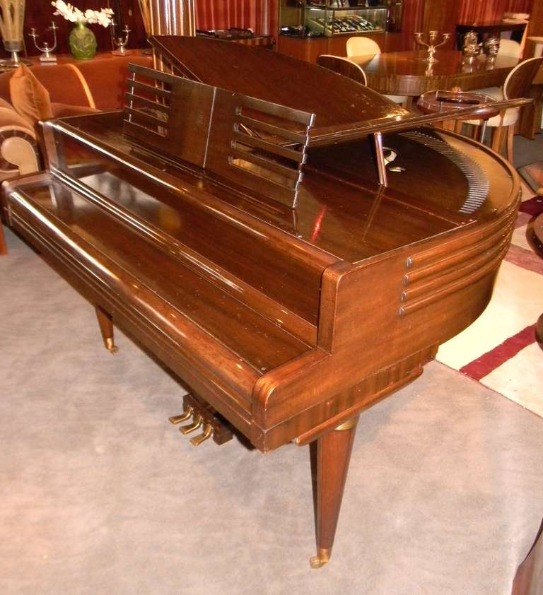 This 1937 Streamline Art Deco Butterfly Wurlitzer Baby Grand Piano is a very rare find. In nice original finish and remarkable condition, we have also made all the adjustments to ensure that the next owner  will have an instrument worthy of playing