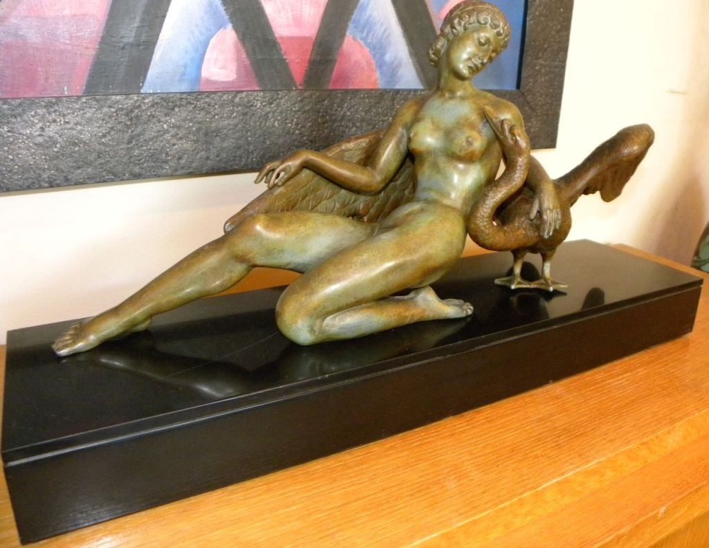 A wonderful rendering from the tale of  Leda and the Swan. Love finds its place all over the world and in many forms. This is a beautiful sculpture rendered in  white bronze or metal with a wonderful rich patina, allowing color and texture to define